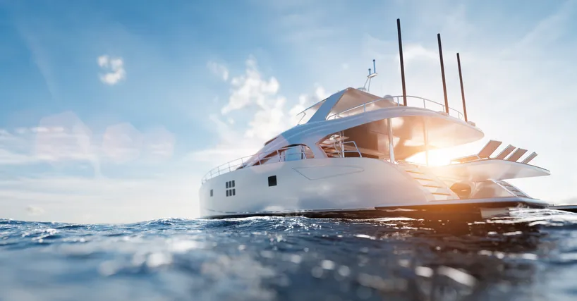 A yacht is in the water on a sunny day.