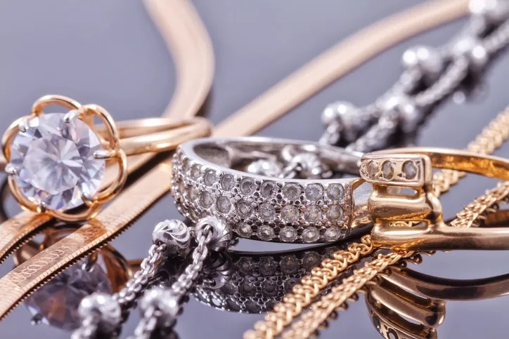 Jewelry is laying on a table.